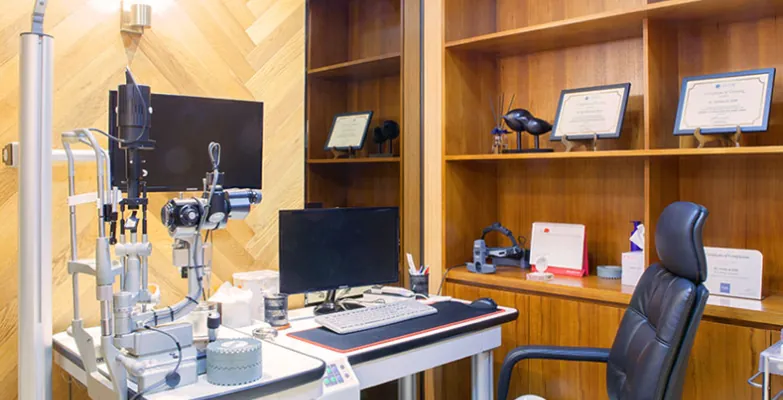 Eye examination room with slit-lamp microscope at Sky Eye Clinic